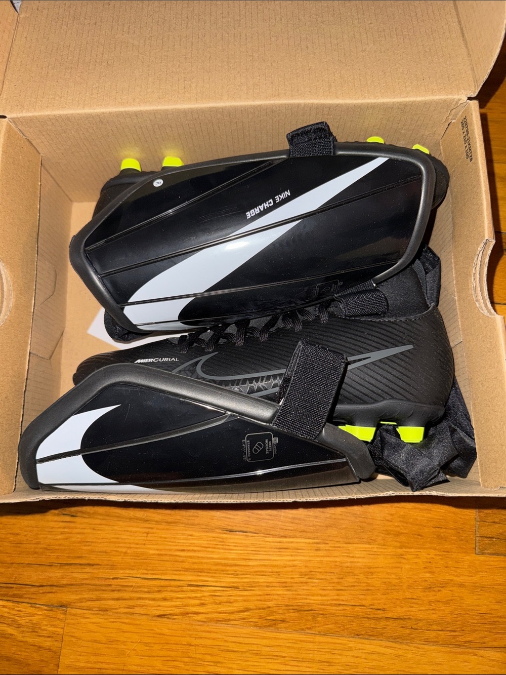 Nike Kids Black and White Soccer Cleats with Neon Yellow Studs